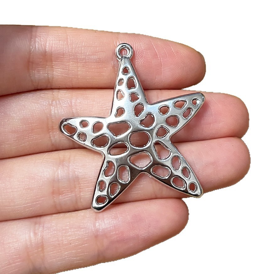 Vintage Fashion Stores - 4 unidades de pingentes prateados estrela